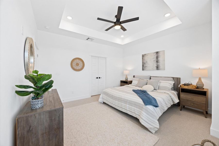 A king-sized layout with vaulted ceilings makes this primary bedroom the perfect blend of charm and functionality. Ceiling fans are not included. A king-sized layout with vaulted ceilings makes this primary bedroom the perfect blend of charm and functionality. Ceiling fans are not included.