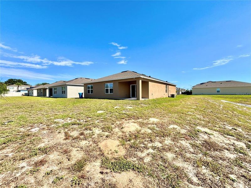 Exterior details and patio area of a home in Cascades, Davenport (Image 1).