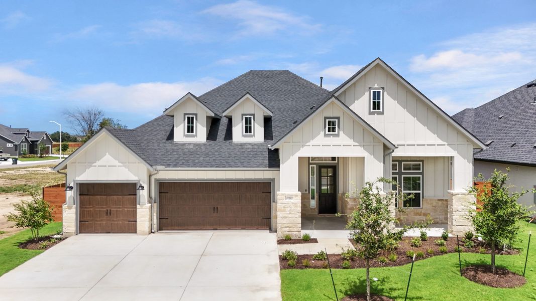 Front exterior of a new home in Broken Oak, Georgetown, TX, highlighting curb appeal (Image 28). Front exterior of a new home in Broken Oak, Georgetown, TX, highlighting curb appeal (Image 28).
