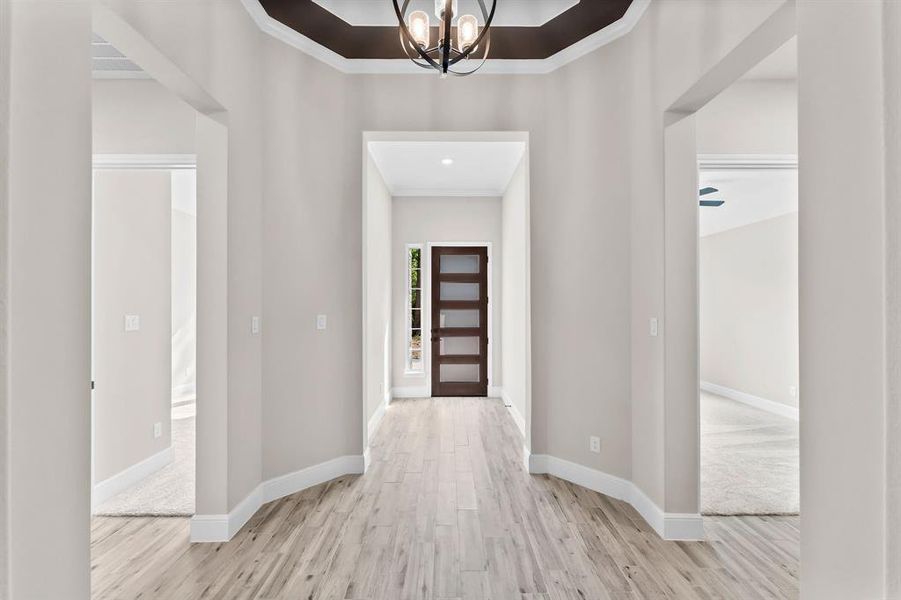 Wonderful foyer with trey ceilings and custom trim