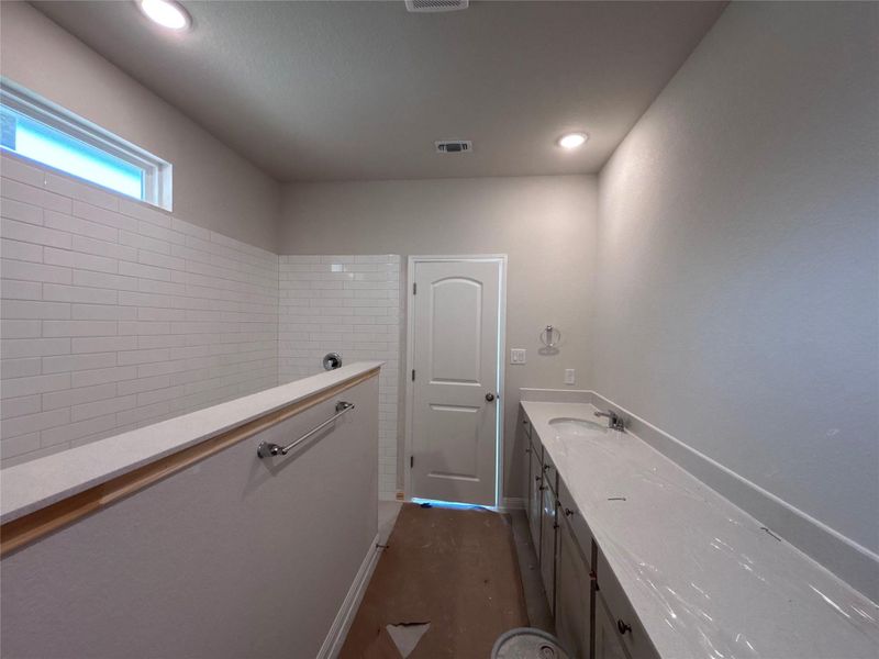 In-progress construction of a new home in The Colony, Bastrop, TX (Image 28).