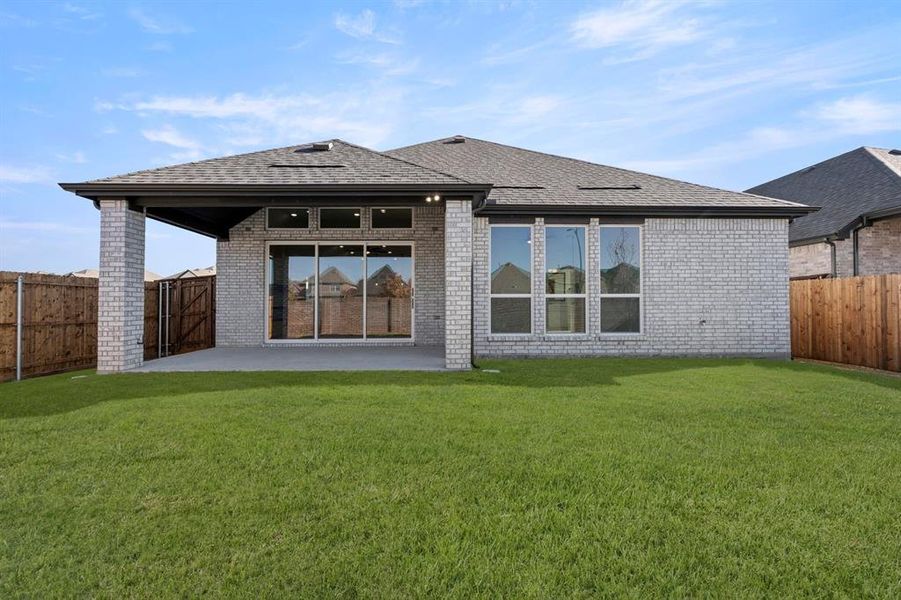 Exterior details and patio area of a home in Valencia on The Lake, Little Elm (Image 4).