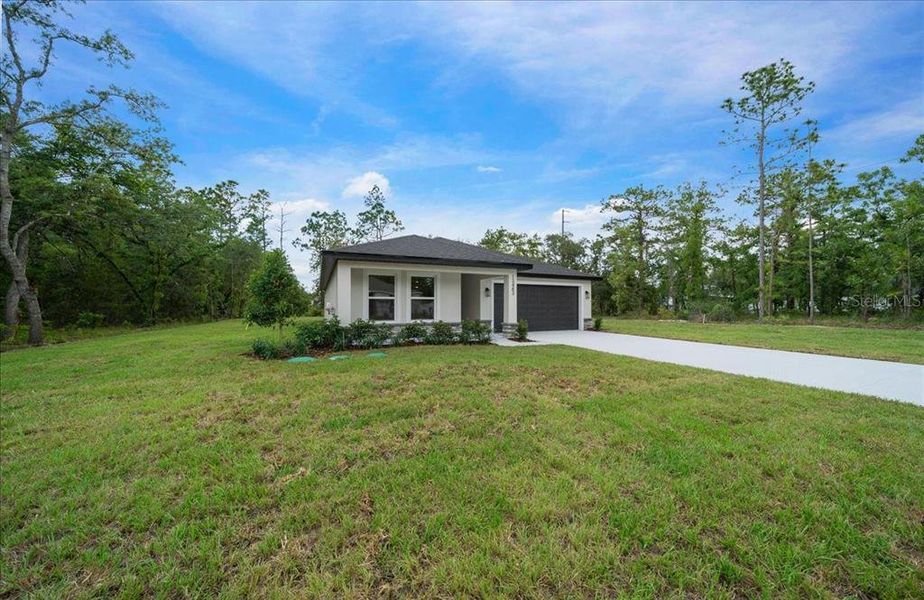 Front exterior of a new home in , Brooksville, FL, highlighting curb appeal (Image 26). Front exterior of a new home in , Brooksville, FL, highlighting curb appeal (Image 26).