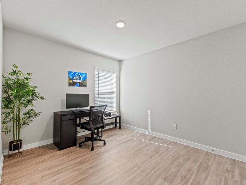 Full secondary bathroom with single vanity and tub-shower combo.