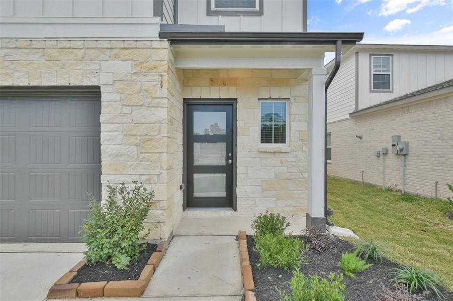 Front exterior of a new home in Lakes at Black Oak, Magnolia, TX, highlighting curb appeal (Image 39).