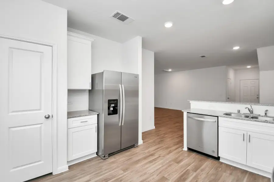 Furnished interior view inside a new home in Decker Farms, Magnolia (Image 9).