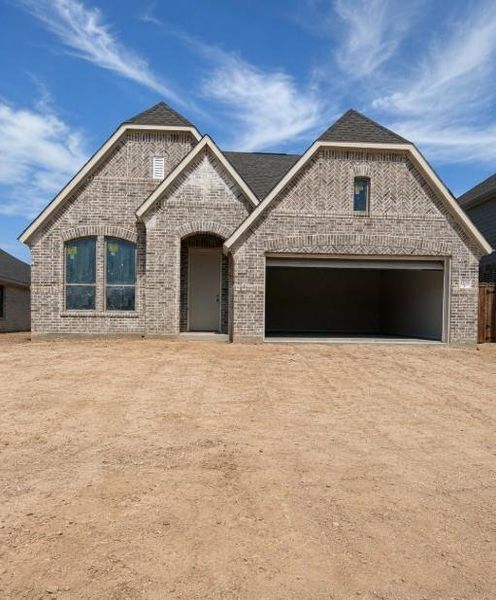 Front exterior of a new home in Escondido, Magnolia, TX, highlighting curb appeal (Image 2). Front exterior of a new home in Escondido, Magnolia, TX, highlighting curb appeal (Image 2).