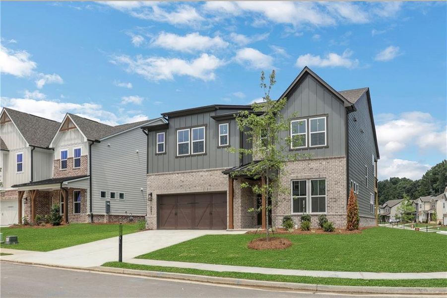 Front exterior of a new home in The Paddocks at Doc Hughes, Buford, GA, highlighting curb appeal (Image 22).