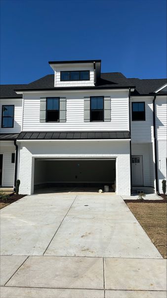 Front exterior of a new home in The Enclave, Greenville, NC, highlighting curb appeal (Image 1). Front exterior of a new home in The Enclave, Greenville, NC, highlighting curb appeal (Image 1).