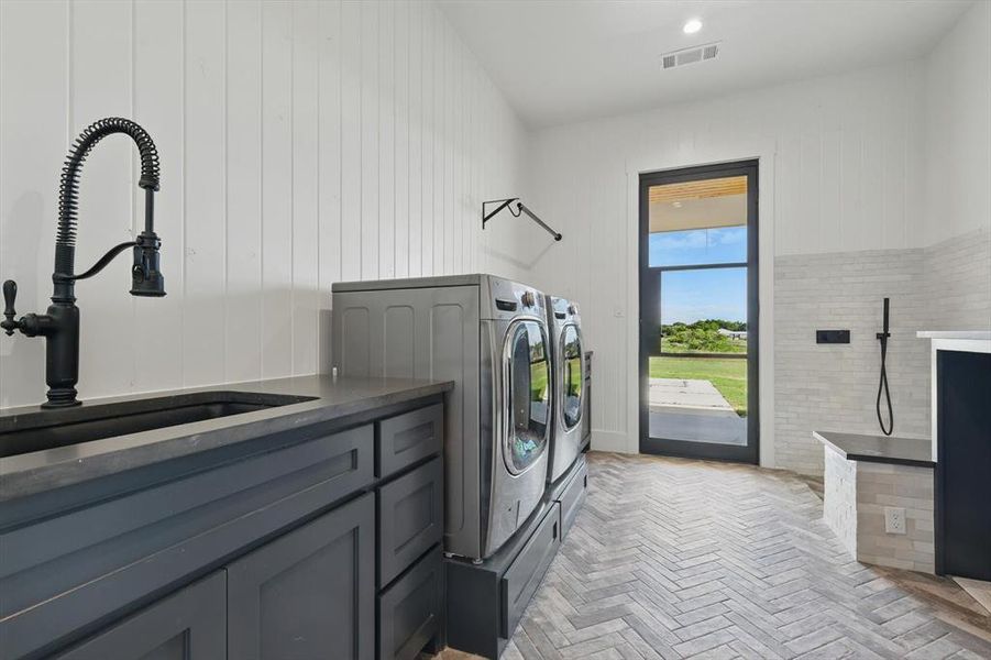 Laundry room featuring washer and clothes dryer and cabinet space Laundry room featuring washer and clothes dryer and cabinet space