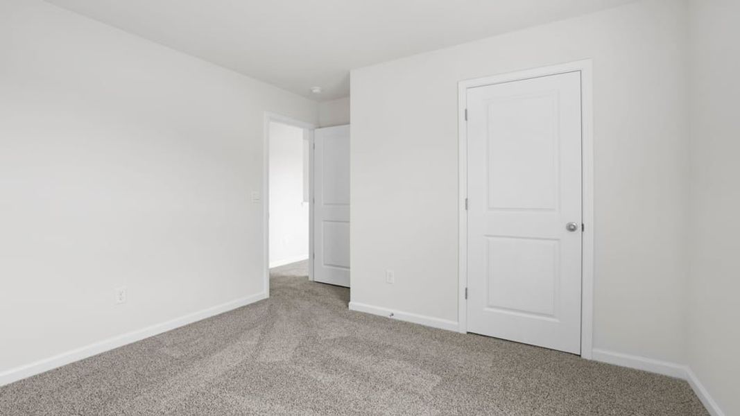 Spacious, unfurnished interior of a new home in Bentley Park, Greenwood (Image 29).