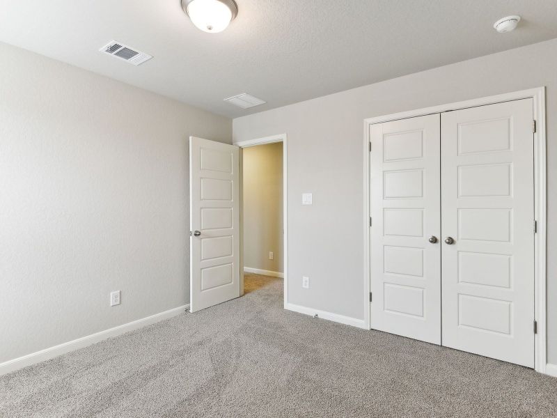 Guest bedroom in the Matador floorplan at a Meritage Homes community.