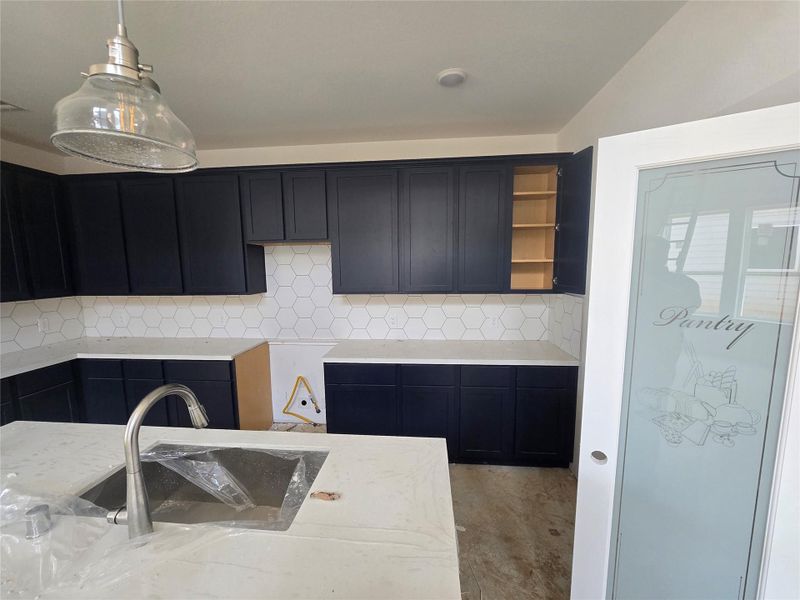 Whip up a batch of Grandma's secret cookies recipe in this sleek stunner of a kitchen!