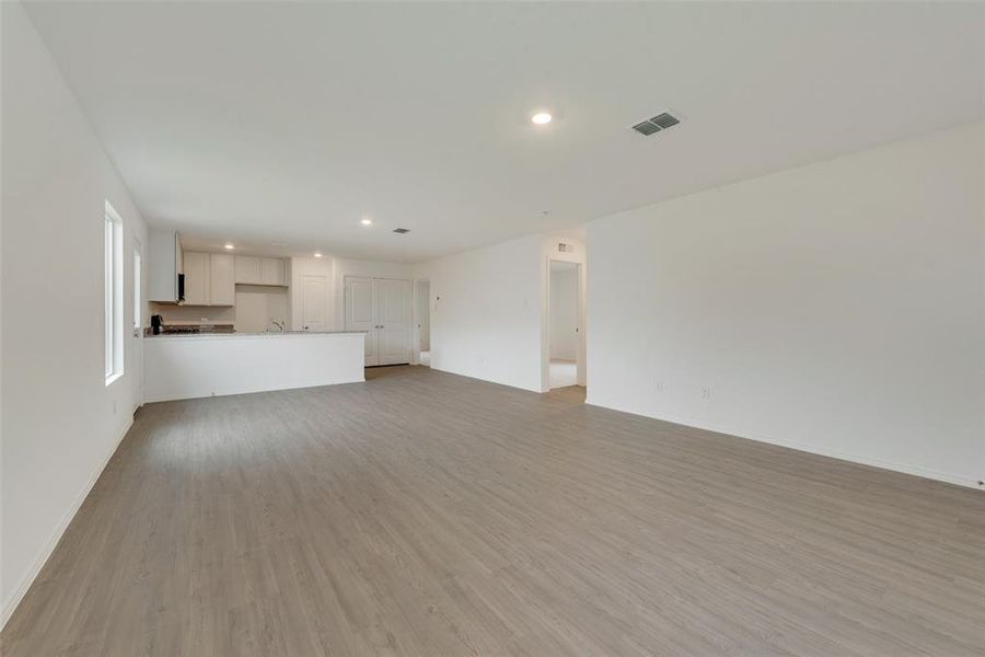 Unfurnished living room with light hardwood / wood-style flooring