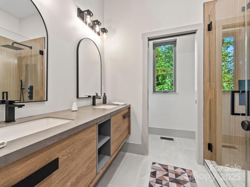 Modern floating double vanity with stone top, water closet