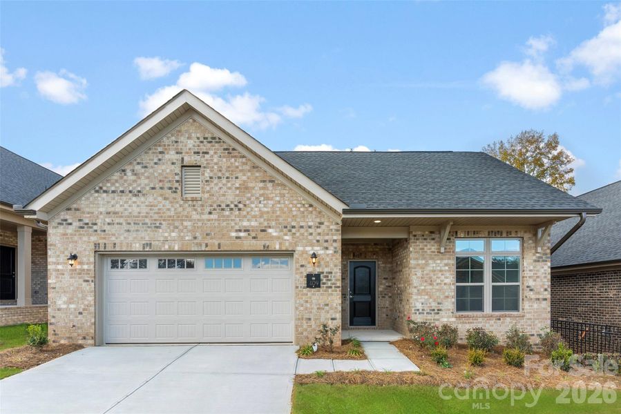 Front exterior of a new home in The Courtyards on New Hope, Gastonia, NC, highlighting curb appeal (Image 2). Front exterior of a new home in The Courtyards on New Hope, Gastonia, NC, highlighting curb appeal (Image 2).
