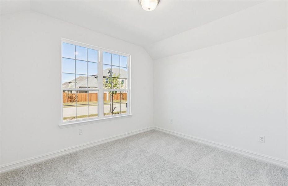 Spacious secondary bedroom with large windows Spacious secondary bedroom with large windows