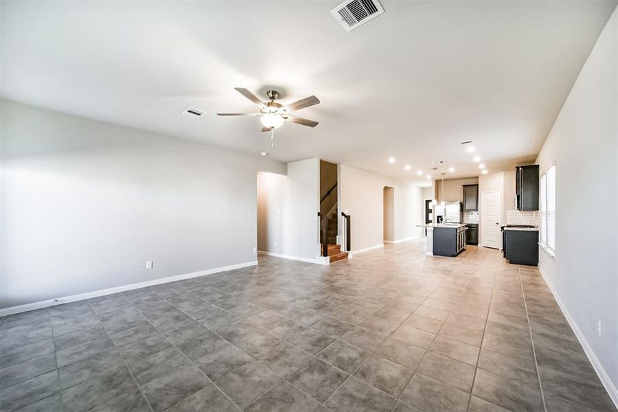 No words can describe the flow of the first floor of this home. As you enter the home, you are immediately introduced to a brightened and open floor plan from the front door, to the family, dining, and kitchen. Stair case is visible as soon as you walk in to provide easy access to the upstairs but tucked away to diminish distraction from the wide open floor plan