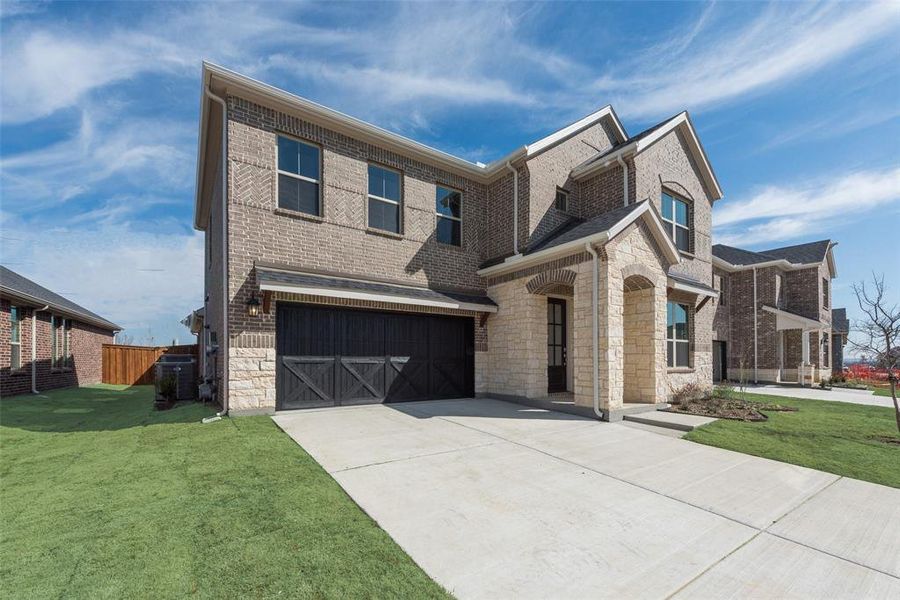 Front exterior of a new home in Sutton Fields, Celina, TX, highlighting curb appeal (Image 1).