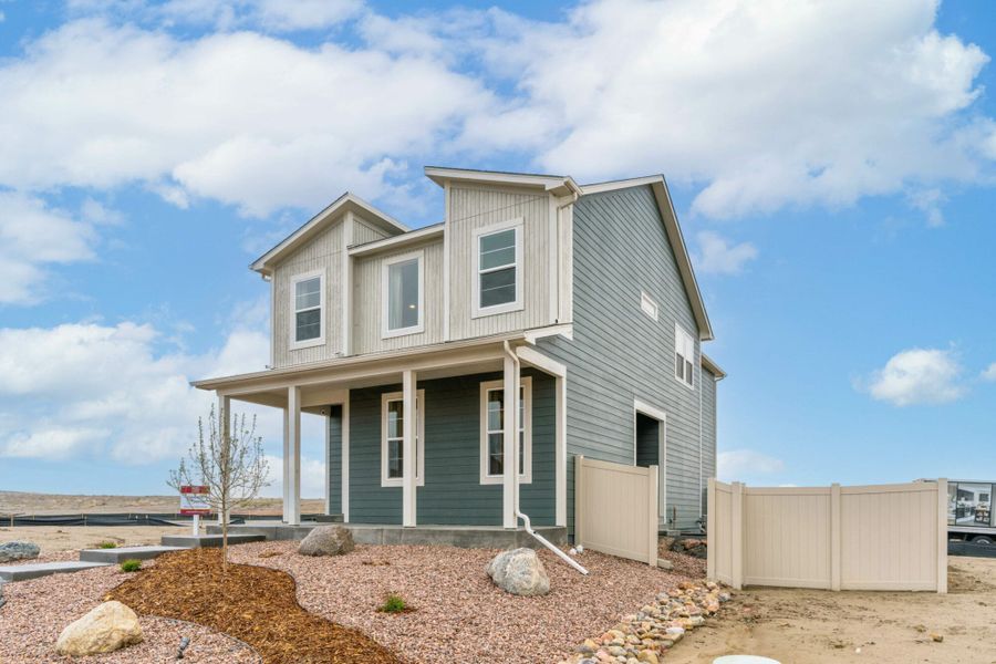Front exterior of a new home in The Trails at Aspen Ridge – Altitude Collection, Colorado Springs, CO, highlighting curb appeal (Image 27). Front exterior of a new home in The Trails at Aspen Ridge – Altitude Collection, Colorado Springs, CO, highlighting curb appeal (Image 27).