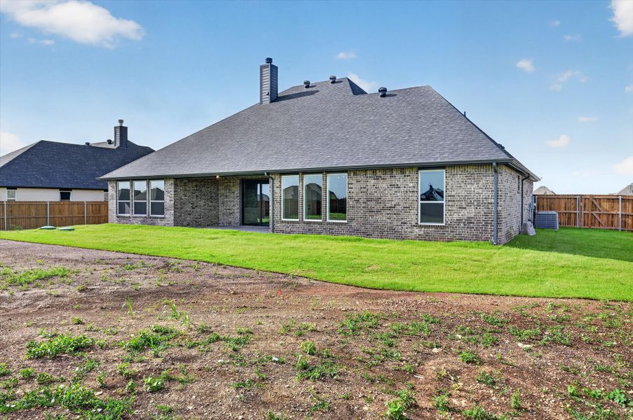 Front exterior of a new home in Coyote Crossing, Godley, TX, highlighting curb appeal (Image 24). Front exterior of a new home in Coyote Crossing, Godley, TX, highlighting curb appeal (Image 24).