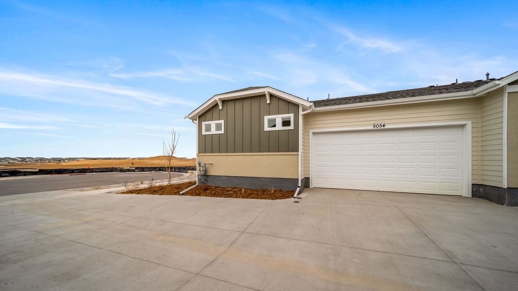 Front exterior of a new home in The Reserve at Green Valley Ranch Aurora, Aurora, CO, highlighting curb appeal (Image 2). Front exterior of a new home in The Reserve at Green Valley Ranch Aurora, Aurora, CO, highlighting curb appeal (Image 2).