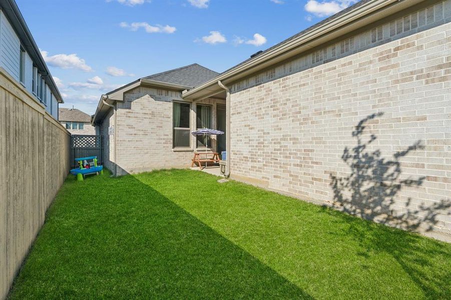 Fenced backyard featuring a patio Fenced backyard featuring a patio