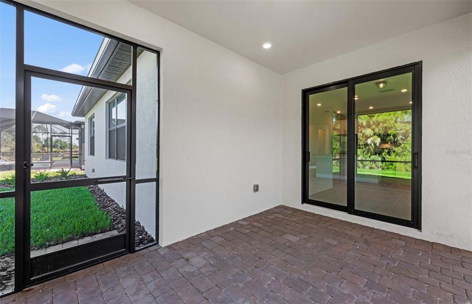Exterior details and patio area of a home in Cedar Grove at The Woodlands, North Port (Image 16).