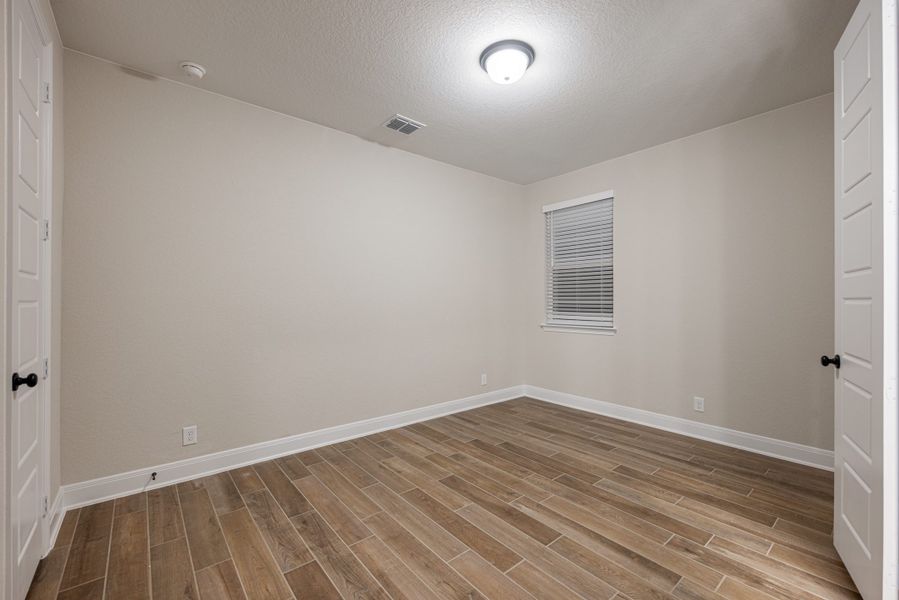 Representative unfurnished interior of a home built from the Mackenzie by Chesmar Homes in Sienna Lakes, San Antonio (Image 24).