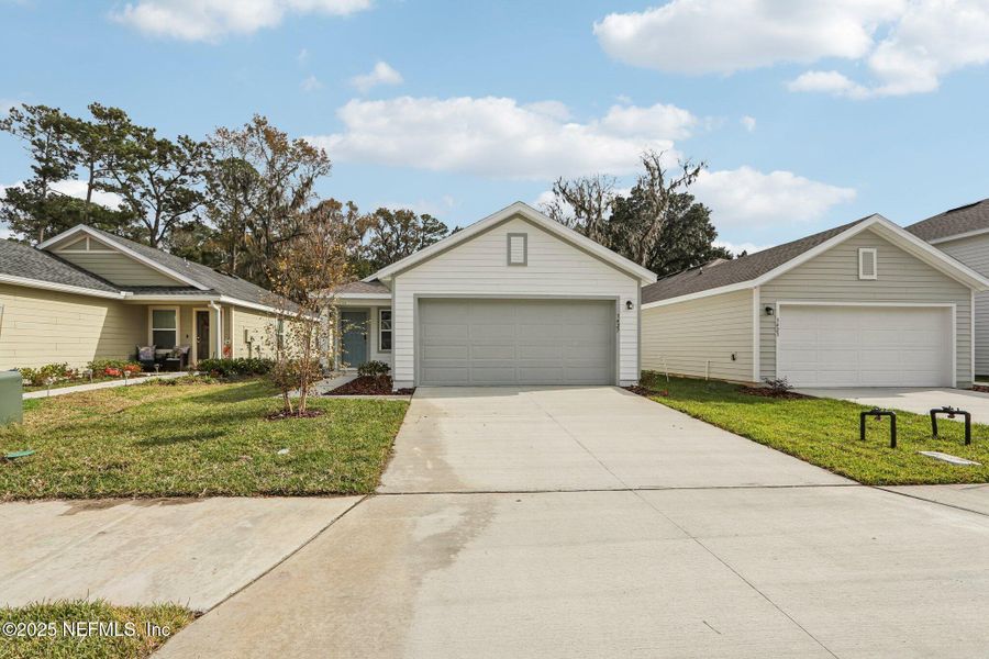 Front exterior of a new home in Kings Landing, Jacksonville, FL, highlighting curb appeal (Image 2). Front exterior of a new home in Kings Landing, Jacksonville, FL, highlighting curb appeal (Image 2).