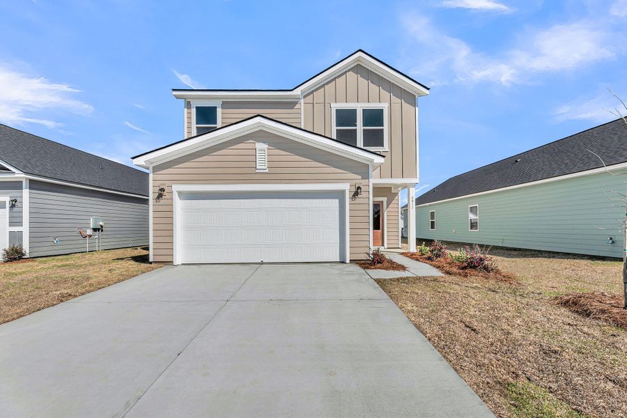Front exterior of a new home in , Ravenel, SC, highlighting curb appeal (Image 17).