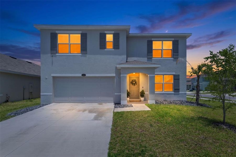 Front exterior of a new home in Epperson, Wesley Chapel, FL, highlighting curb appeal (Image 25). Front exterior of a new home in Epperson, Wesley Chapel, FL, highlighting curb appeal (Image 25).