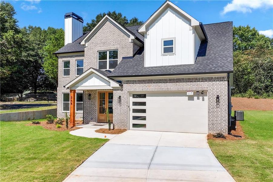 Front exterior of a new home in , Lawrenceville, GA, highlighting curb appeal (Image 24). Front exterior of a new home in , Lawrenceville, GA, highlighting curb appeal (Image 24).