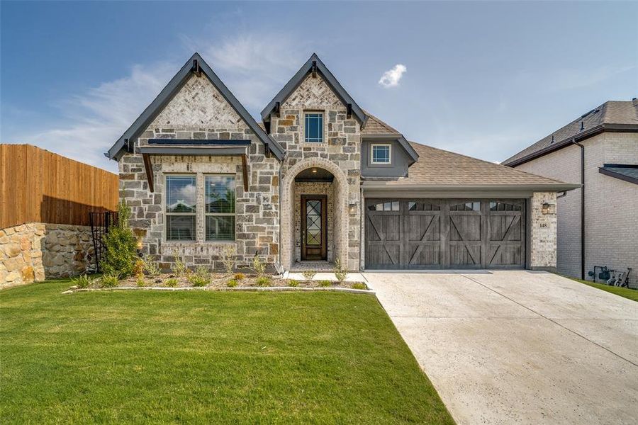 Front exterior of a new home in Parks of Aledo, Aledo, TX, highlighting curb appeal (Image 2). Front exterior of a new home in Parks of Aledo, Aledo, TX, highlighting curb appeal (Image 2).