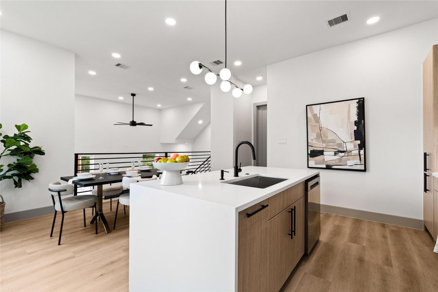 Modern minimalism meets effortless functionality—this oversized island anchors the open-concept layout with clean quartz surfaces, matte black fixtures, and built-in storage. Whether you’re prepping dinner or hosting friends, it’s the everyday centerpiece that does it all with style. Modern minimalism meets effortless functionality—this oversized island anchors the open-concept layout with clean quartz surfaces, matte black fixtures, and built-in storage. Whether you’re prepping dinner or hosting friends, it’s the everyday centerpiece that does it all with style.