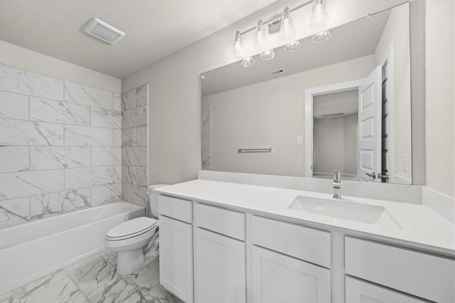 Furnished interior view inside a new home in Barton Creek Ranch, Conroe (Image 9).