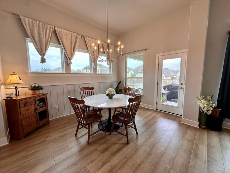 Dining area with shiplap accent wall.