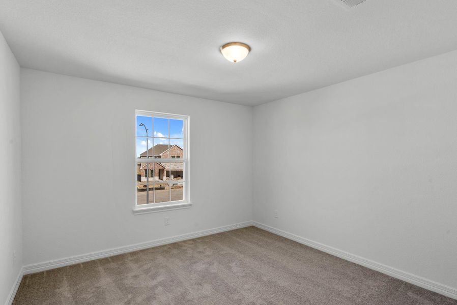 Secondary upstairs bedroom.