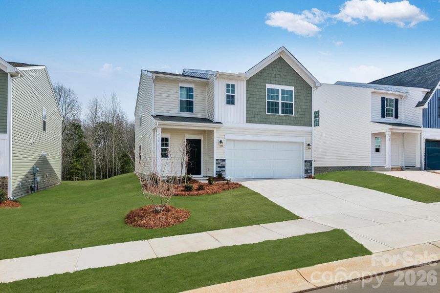 Front exterior of a new home in Cleveland Hill, Shelby, NC, highlighting curb appeal (Image 2). Front exterior of a new home in Cleveland Hill, Shelby, NC, highlighting curb appeal (Image 2).
