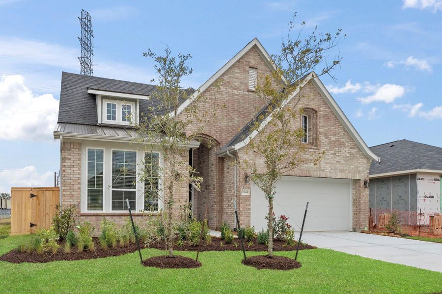 Front exterior of a new home in Mulberry Farms, Santa Fe, TX, highlighting curb appeal (Image 2). Front exterior of a new home in Mulberry Farms, Santa Fe, TX, highlighting curb appeal (Image 2).