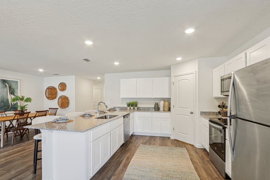 A kitchen with white cabinets. A kitchen with white cabinets.
