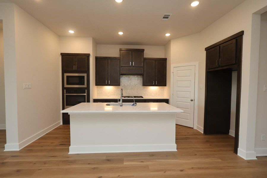 Furnished interior view inside a new home in Woodson’s Reserve, Spring (Image 8). Furnished interior view inside a new home in Woodson’s Reserve, Spring (Image 8).