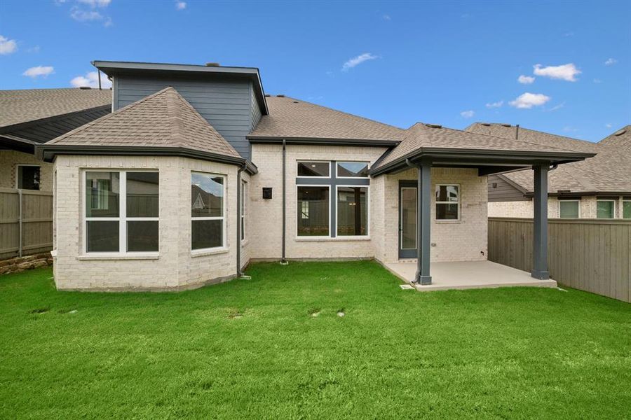 Front exterior of a new home in Pecan Square - Gardens, Northlake, TX, highlighting curb appeal (Image 19). Front exterior of a new home in Pecan Square - Gardens, Northlake, TX, highlighting curb appeal (Image 19).