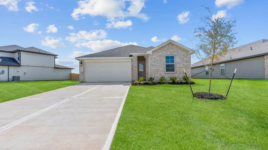 Front exterior of a new home in Tamarron, Fulshear, TX, highlighting curb appeal (Image 2). Front exterior of a new home in Tamarron, Fulshear, TX, highlighting curb appeal (Image 2).