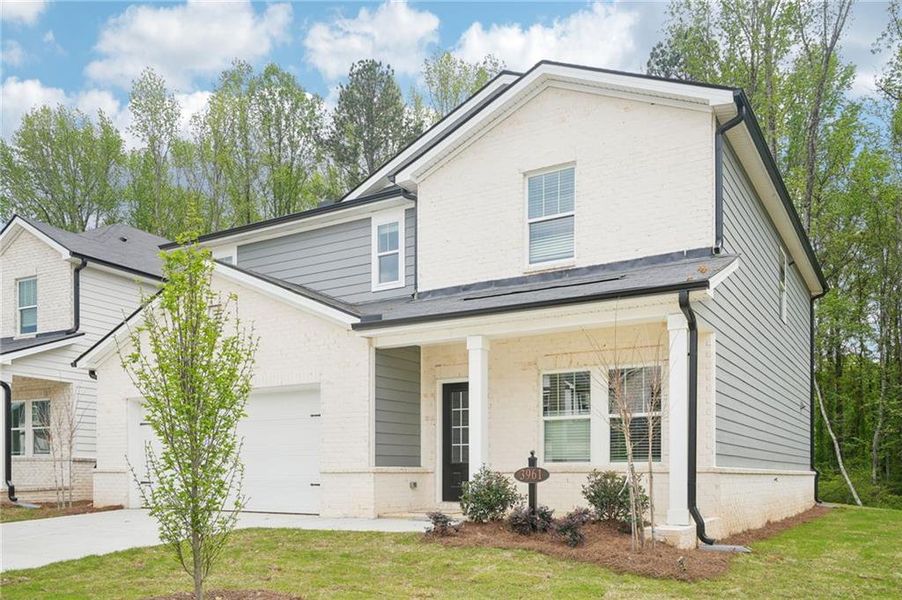 Front exterior of a new home in Westmont Preserve, Powder Springs, GA, highlighting curb appeal (Image 19). Front exterior of a new home in Westmont Preserve, Powder Springs, GA, highlighting curb appeal (Image 19).