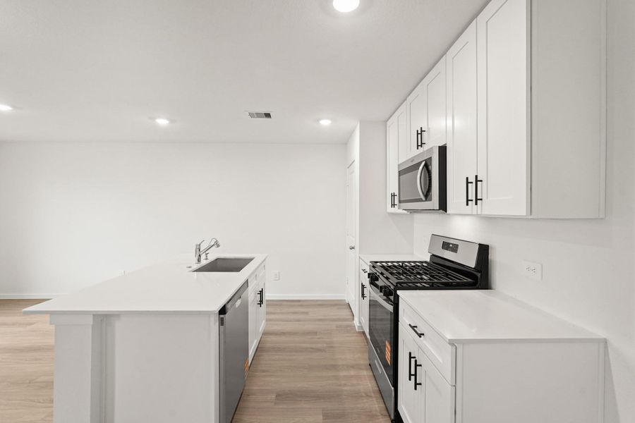 Furnished interior view inside a new home in Sunterra, Katy (Image 7).