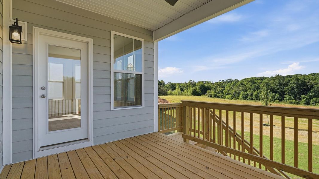Vibrant rear outdoor space featuring a covered deck and exceptional craftsmanship in Woodruff, SC