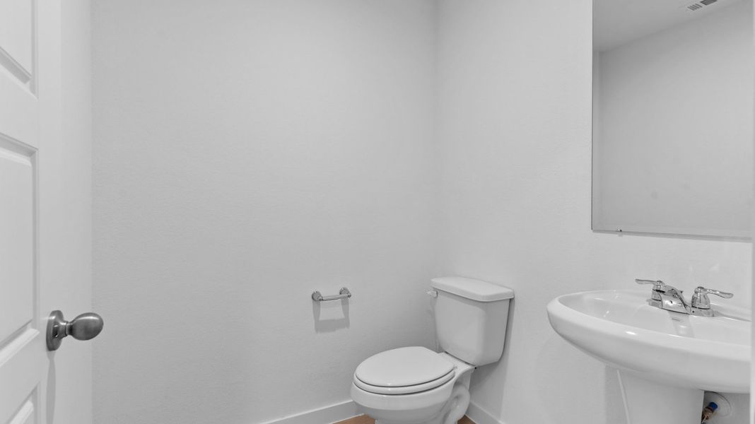 Furnished interior view inside a new home in Caldwell Crossing, Iowa Colony (Image 7).