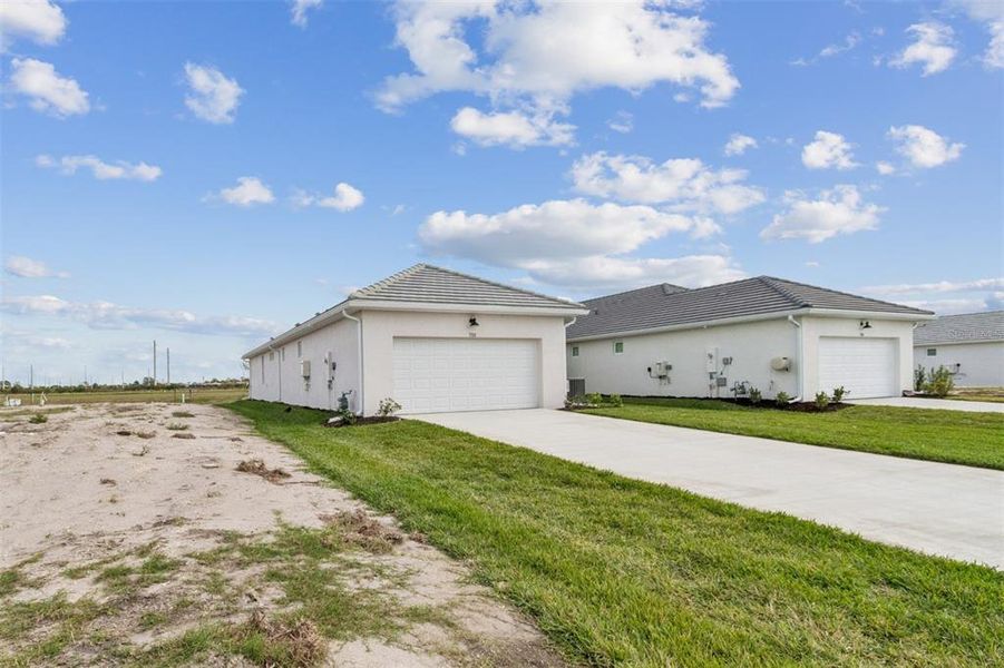 Front exterior of a new home in Vistera of Venice – Cottage Series, Nokomis, FL, highlighting curb appeal (Image 20).