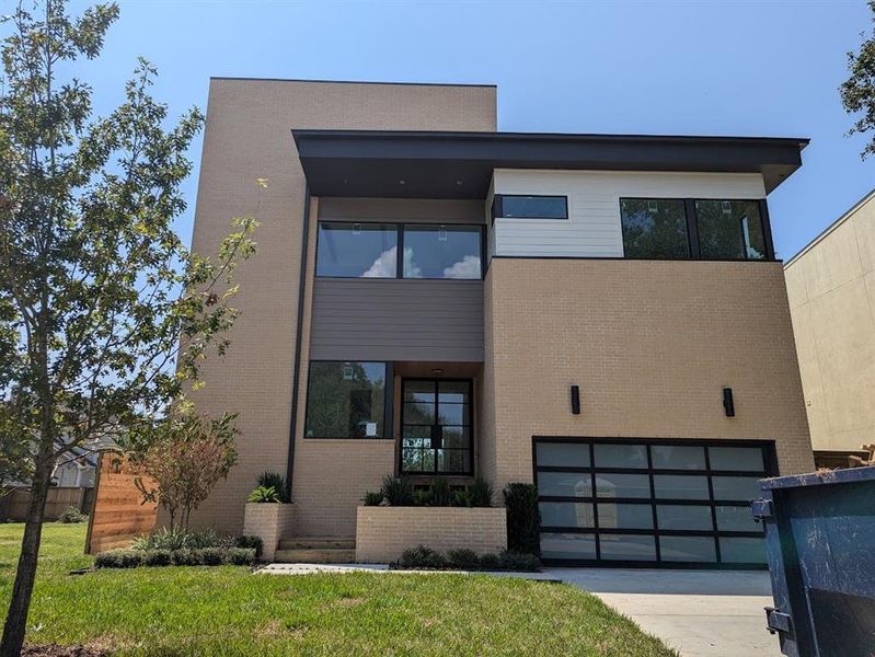 Front view of house under construction.